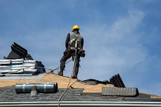 Professional Roof Replacement technician working in Reading, MA